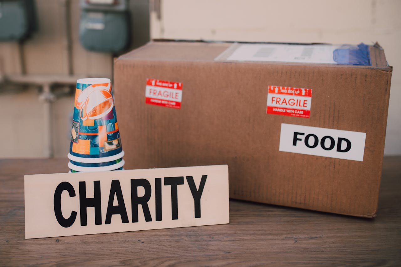 The Art of Drawing Readers In: Your attractive post title goes here Image of a charity donation box filled with food supplies and paper cups.
